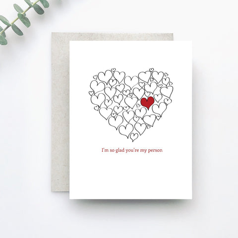 A heart shape is made up of little hearts, but one is special above them all in this sweet card that tells them, "I'm so glad you're my person".